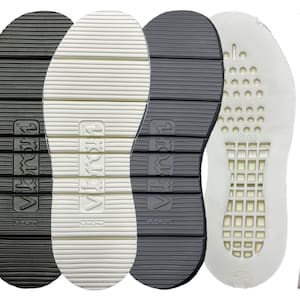 May include: Four different shoe soles, two black, one white, and one light grey. The soles have a textured pattern and the word "Vibram" is printed on the side. The light grey sole has a grid pattern and the number "9105" printed on it.
