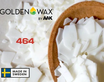 May include: White wax flakes in a wooden spoon. The wax is labeled "GOLDEN WAX BY AAK" and "464". The label also includes a Swedish flag and the text "MADE IN SWEDEN".
