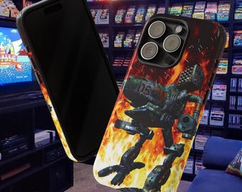 May include: Black smartphone case featuring a green and black robot design set against a fiery orange and yellow background. The case is shown with a black smartphone, showcasing the design and the phone's camera.