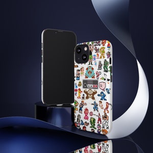 May include: A white phone case with a pixelated design featuring various video game characters and a Nintendo controller. The case is shown next to a black phone.