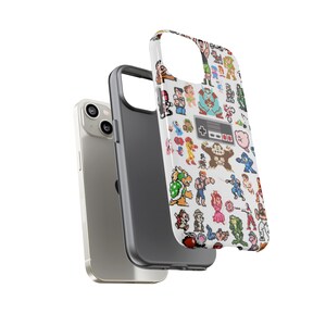 May include: A white phone case with a pixelated design of various video game characters and a Nintendo controller. The case is shown with a silver phone.