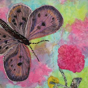 May include: A purple and brown butterfly with black spots and a white outline is embroidered on a pink, blue, and green fabric background. A pink flower is in the lower right corner of the image.