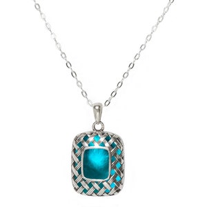 May include: A silver chain necklace with a pendant featuring a turquoise blue gemstone set in a silver frame with a woven design.