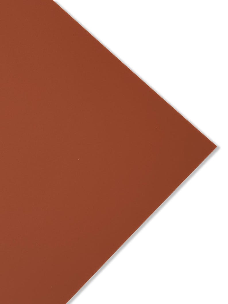 May include: A solid piece of terracotta-colored craft paper.