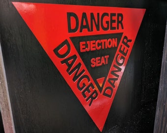 Waarschuwingssticker klapstoel: voor de piloot in jou!