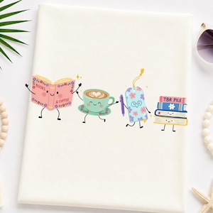 May include: A white fabric surface featuring a colorful graphic of four anthropomorphic characters: an open pink book labeled "BOOKS & COFFEE", a light green coffee cup, a blue floral bookmark with glasses, and a stack of books labeled "TBR PILE".