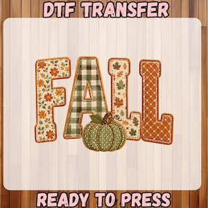 May include: A DTF transfer sheet featuring the word FALL in block letters with varied patterns including orange flowers, green plaid, autumn leaves, and orange polka dots, accompanied by a green polka dot pumpkin graphic and text READY TO PRESS.
