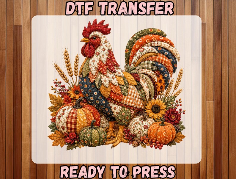 May include: A DTF TRANSFER READY TO PRESS graphic featuring a rooster with a patchwork-style pattern in shades of red, orange, blue, and green. The rooster is surrounded by autumn elements including pumpkins, wheat stalks, sunflowers, and fall leaves.