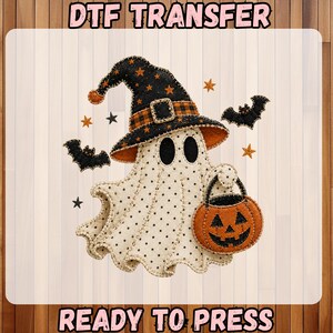 May include: A DTF transfer featuring a cream-colored ghost with black polka dots, wearing a black witch hat with orange stars and a plaid band. The ghost holds an orange jack-o'-lantern bucket, surrounded by black bats and small stars.