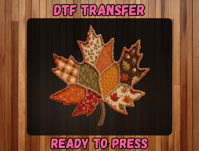 May include: A DTF transfer featuring a large maple leaf graphic composed of various fabric-like patches in autumn colors including orange, brown, green, and cream. The text DTF TRANSFER and READY TO PRESS appears in pink letters above and below the leaf.