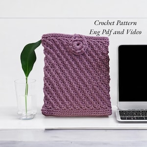May include: Purple crocheted laptop sleeve with a flower design. Crochet Pattern Eng Pdf and Video.