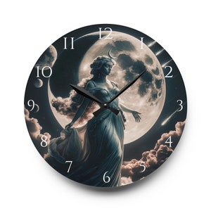 May include: A round clock with a black background and white numbers. The clock face features a woman with long flowing hair standing in front of a large, full moon. The moon has a crescent moon shape on its surface. The clock hands are black.