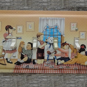 May include: Decorative light switch cover featuring a whimsical illustration of children and pets in a cozy room setting. The artwork includes a girl in a red and white dress, a boy with a puppy, and a teddy bear. The cover has three light switches.