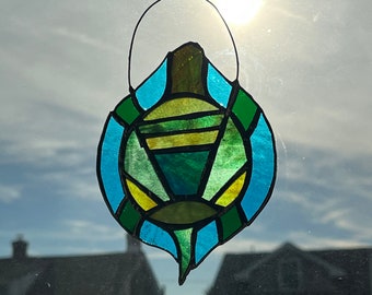 My Turtle stretches to the sky. A Stratozpheric Stained Glass Suncatcher