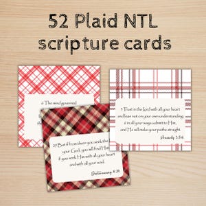 May include: A collection of 52 plaid scripture cards. The cards feature a plaid pattern in red, white, and brown. Each card has a Bible verse printed on it. The text on the cards includes "52 Plaid NTL scripture cards."