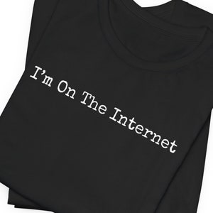 May include: Black t-shirt with the text "I'm On The Internet" in white.