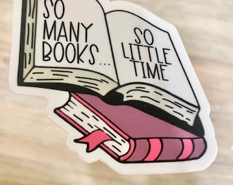 May include: A sticker featuring two open books, one atop the other. The top book is white with black text that reads "SO MANY BOOKS..." and "SO LITTLE TIME." The bottom book is pink with a pink ribbon bookmark.