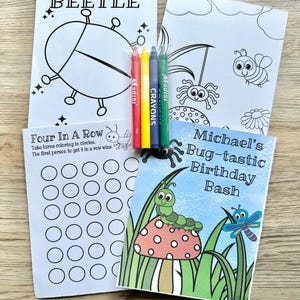 May include: A set of activity sheets including a Draw Your Own Beetle page, a Four In A Row game, and a Michael's Bug-tastic Birthday Bash cover. Four crayons in red, yellow, blue, and green are placed on top of the white paper activity sheets.