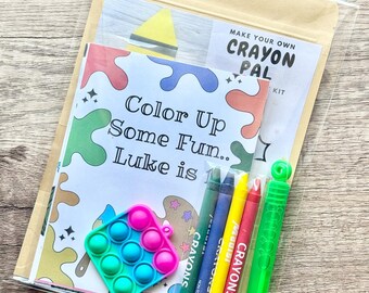 May include: A Make Your Own Crayon Pal kit in a clear plastic bag containing a coloring card with the text Color Up Some Fun.. Luke is, a small square pink and blue pop-it fidget toy, three crayons in green, blue, yellow, and red, and a green bubble wand.