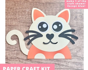 May include: A paper craft kit featuring a cat design with a cream-colored head, orange body, and black whiskers. The text reads: Includes everything needed to make 1 of the craft shown! Except Glue! PAPER CRAFT KIT PRE-CUT CRAFTS FOR KIDS.