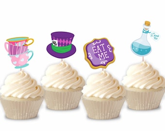 May include: Four cupcakes with white frosting, each topped with a different Alice in Wonderland-themed decoration. Decorations include stacked teacups, a purple hat, a sign that says "EAT ME", and a potion bottle with a "Drink Me" tag.