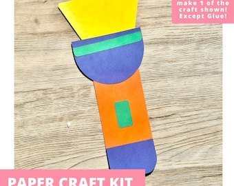 May include: A paper craft kit shaped like a flashlight, featuring a yellow beam, a purple head with a green band, an orange handle with a green button, and a purple base. The text reads: Includes everything needed to make 1 of the craft shown! Except Glue!