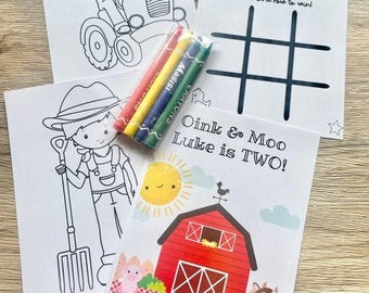 May include: A set of farm-themed activity sheets including two black and white coloring pages featuring a child on a tractor and a child with a pitchfork, a tic tac toe game, and a colorful card with a red barn, sun, pig, cow, and text Oink & Moo Luke is TWO!, accompanied by four crayons.