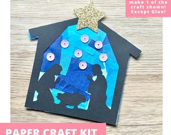 May include: A paper craft kit featuring a black nativity silhouette cutout layered over blue tissue paper. The design includes a gold glitter star at the top and pink sequins. The text reads: Includes everything needed to make 1 of the craft shown! Except Glue! PAPER CRAFT KIT PRE-CUT CRAFTS FOR KIDS