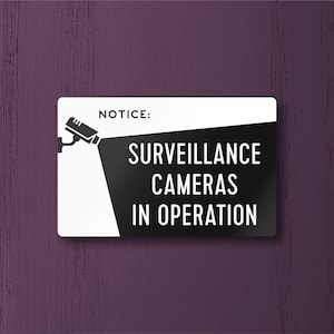 SURVEILLANCE CAMERAS In OPERATION Sign - Lightweight and easy to install, modern designs, made to order. With camera icon.
