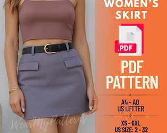 May include: A woman wearing a mauve crop top and a gray skirt with a black belt. The skirt has two front pockets. The image also includes a PDF pattern for a skirt, with size options from XS to 6XL.