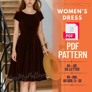 May include: A burgundy dress with short sleeves and a flared skirt. The image includes text that reads "WOMEN'S DRESS .PDF PDF PATTERN" and size details. A straw hat is held in the model's hand.