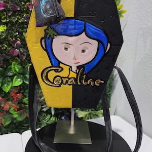 Coraline coffin-style backpack and handbag image 1