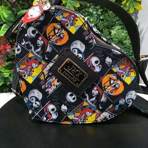 May include: A heart-shaped crossbody bag featuring a colorful all-over print of characters from The Nightmare Before Christmas. The bag has a black top handle, a gold-tone zipper, and a central black plaque with the text JACK and Loungefly.