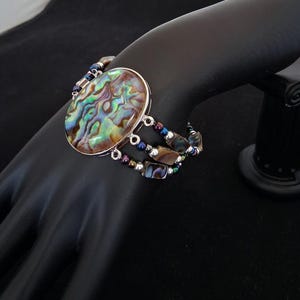 Collana, bracciale e orecchini in abalone immagine 6