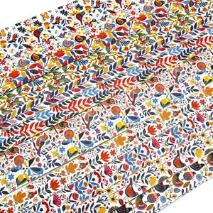 May include: A collection of patterned paper strips featuring a vibrant floral and bird design. The patterns include colorful birds, flowers, and leaves in red, blue, yellow, and orange on a white background. The strips are arranged in a diagonal stack.