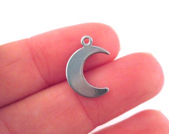 May include: A silver crescent moon charm pendant with a loop for attaching to jewelry.
