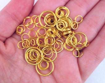 Assorted Gold Plated Jump Rings, 10 grams  (125-200 pieces) C230