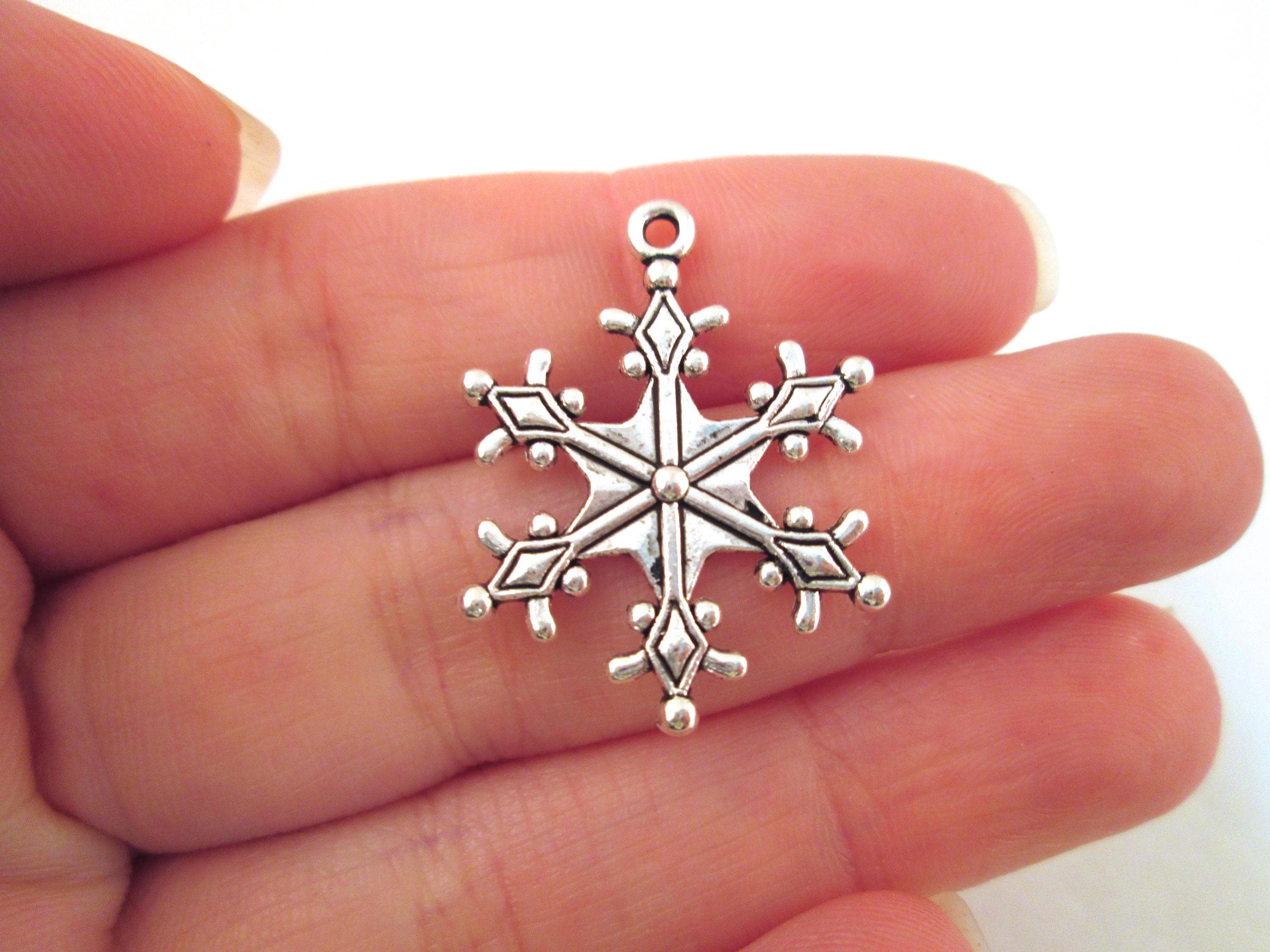 Silver snowflake shop charm