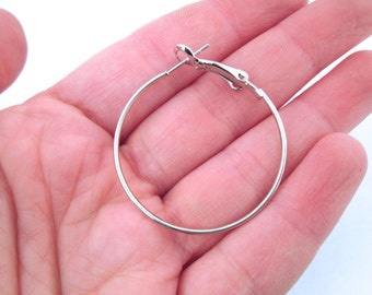 6 pair 35mm hoop earrings, silver plated with a spring clasp  C58