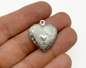 3 Stainless Steel Heart Lockets With Decorative Patterns On The Front  B143