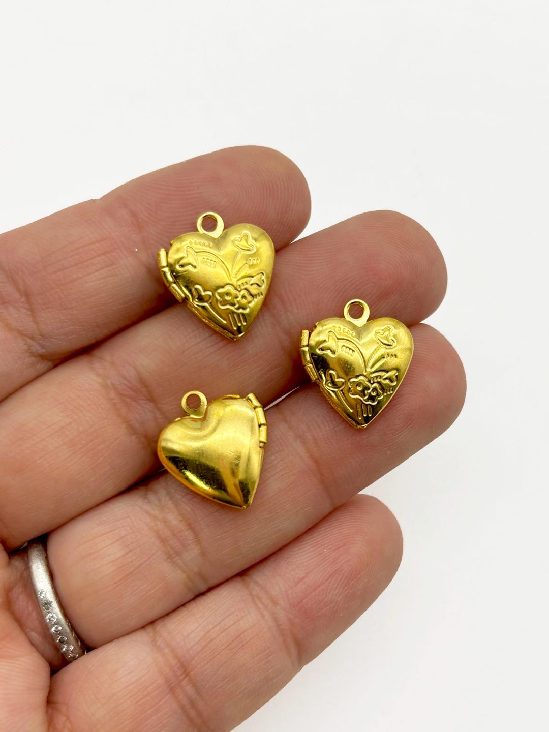 Heart Lockets Examples 4 Small Gold Plated Heart Lockets With Decorative Patterns on the Front ...
