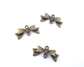 Bow connectors pendant charms, brass plated, pick your amount, F258