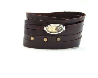 Shi Bandit Cuff: Brown Leather Wrap Cuff with Brass Studs and Silk Charm