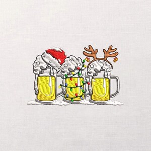 May include: Embroidered design of three beer mugs filled with yellow liquid and white foam. One mug has a Santa hat, another has Christmas lights, and the third has reindeer antlers. The mugs are on a white background.