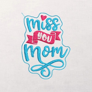 May include: Embroidered design with the words "Miss You Mom" in turquoise and pink. The text is in a stylized script, with a heart above the word "miss". The design is on a white background.