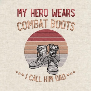 May include: Embroidered design with combat boots and the text "MY HERO WEARS COMBAT BOOTS I CALL HIM DAD". The design features a sunset backdrop with red and brown tones.