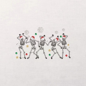 May include: Embroidered design featuring five dancing skeletons wearing Santa hats. The skeletons are black and white, with green, red, and gold accents. Snowflakes and stars are also embroidered on the white background.