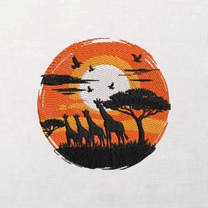 May include: Embroidered design featuring a sunset scene with giraffes, trees, and birds. The design is circular, with a vibrant orange and yellow sunset in the background. Silhouetted giraffes and trees are in the foreground, with birds flying above.