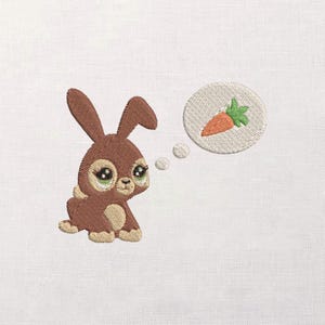 May include: Embroidered design of a brown bunny with large, expressive eyes, sitting and looking up. A thought bubble shows a carrot. The bunny has tan accents on its paws and belly, with a white background.