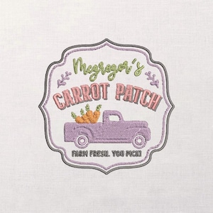 May include: Embroidered patch featuring a purple vintage pickup truck carrying carrots. The text reads "McGregor's Carrot Patch" in pink and green, with the phrase "Farm Fresh, You Pick!" below. The design is framed by a decorative border.